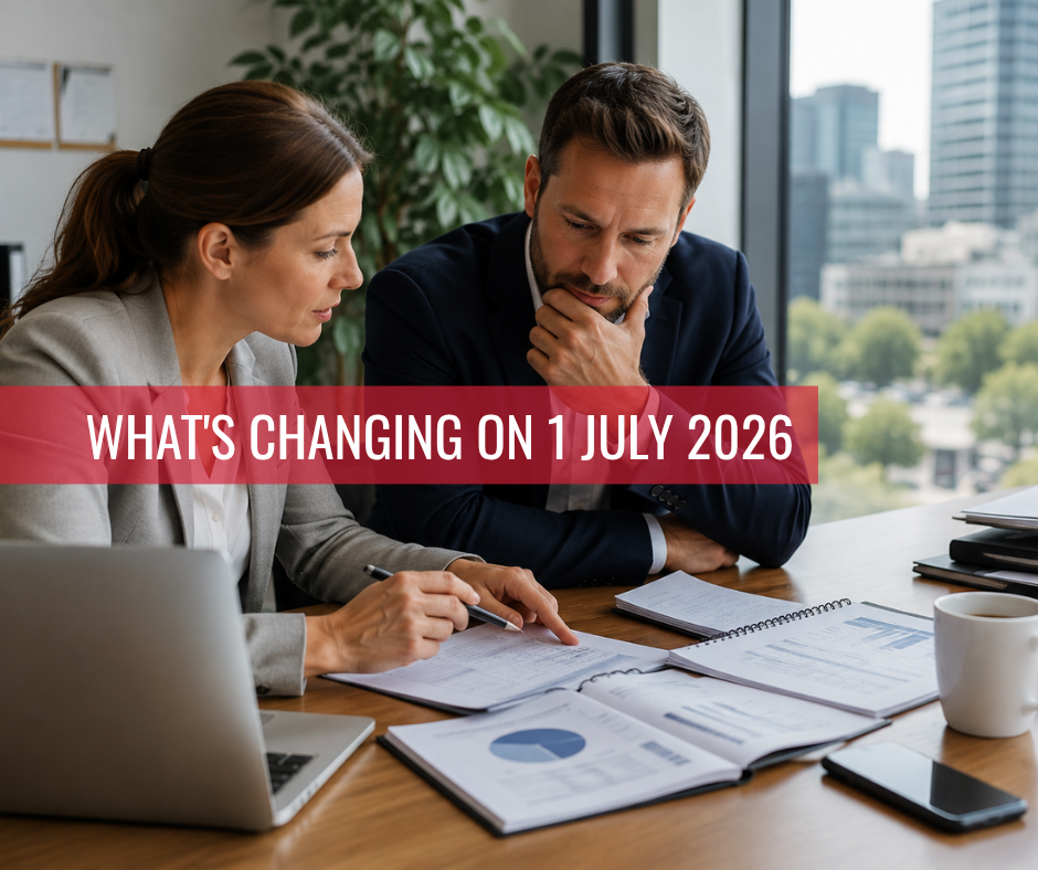 Two business professionals reviewing workplace compliance documents in a modern office ahead of major Australian employment law changes taking effect on 1 July 2026.
