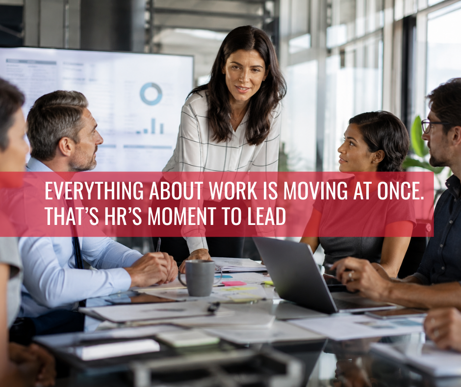 HR leader discussing workforce strategy and the future of work with a diverse executive team in a modern office environment.